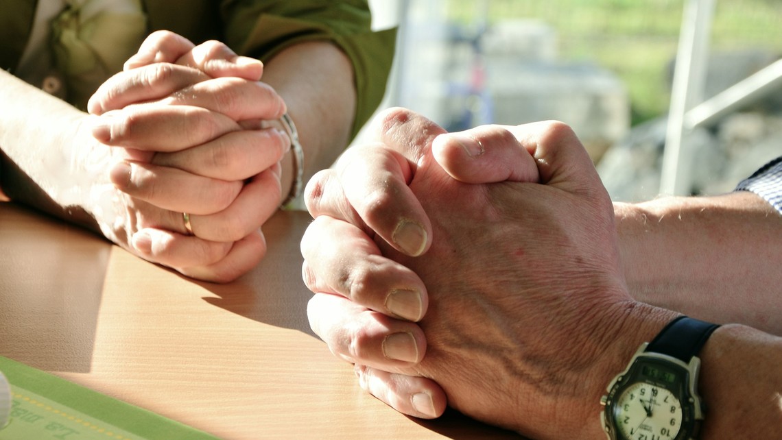 Hands praying
